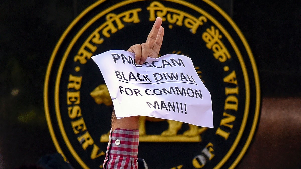 A depositor of Punjab and Maharashtra Cooperative (PMC) bank displays a placard during a protest over the banks crisis, outside the Reserve Bank of India building, in Mumbai. Image used for representation. Image used for representation.