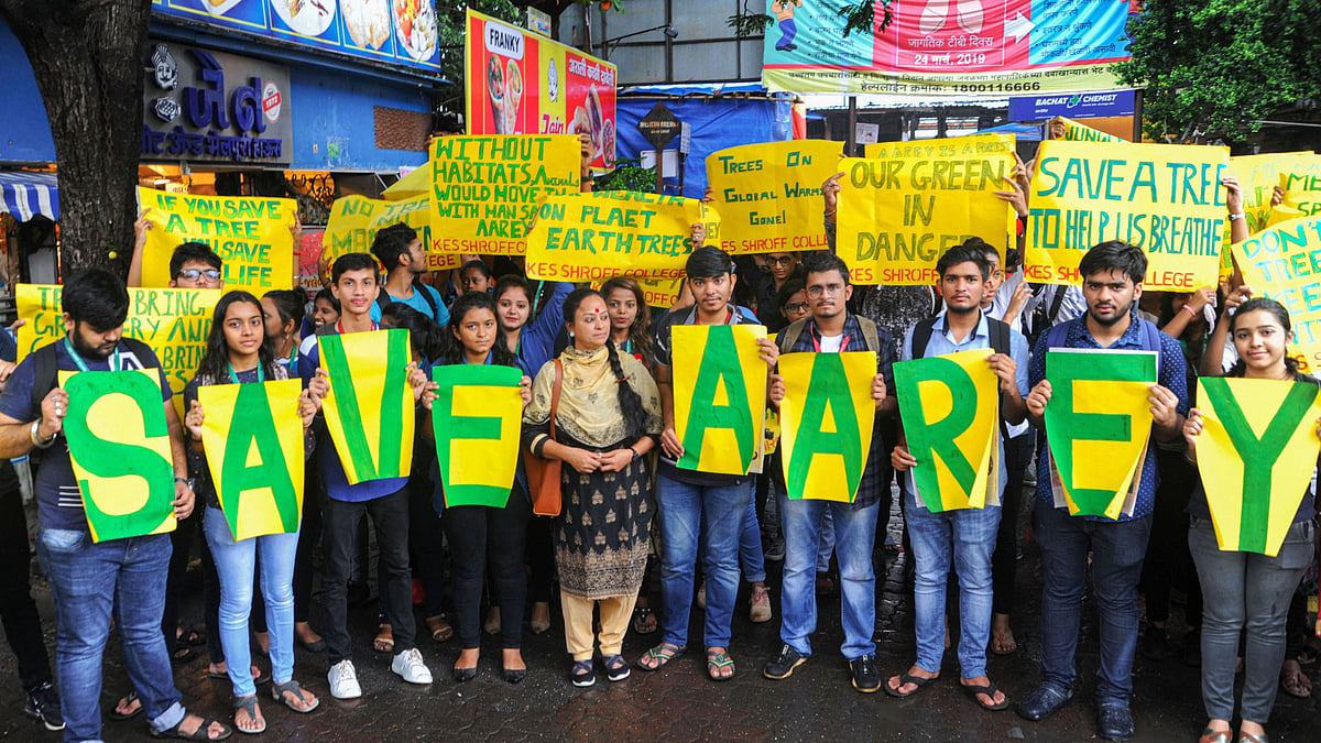 People protest the felling of trees by Mumbai Metro Rail Corporation Ltd in Aarey Milk Colony.