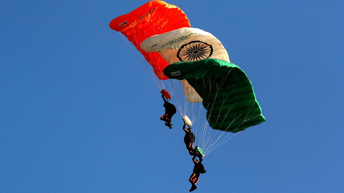 Members of Akash Ganga sky diving team of the Indian Air Force display their skill during the Air Force Day parade at the Hindon air base on the outskirts of New Delhi on Tuesday, 8 October. 