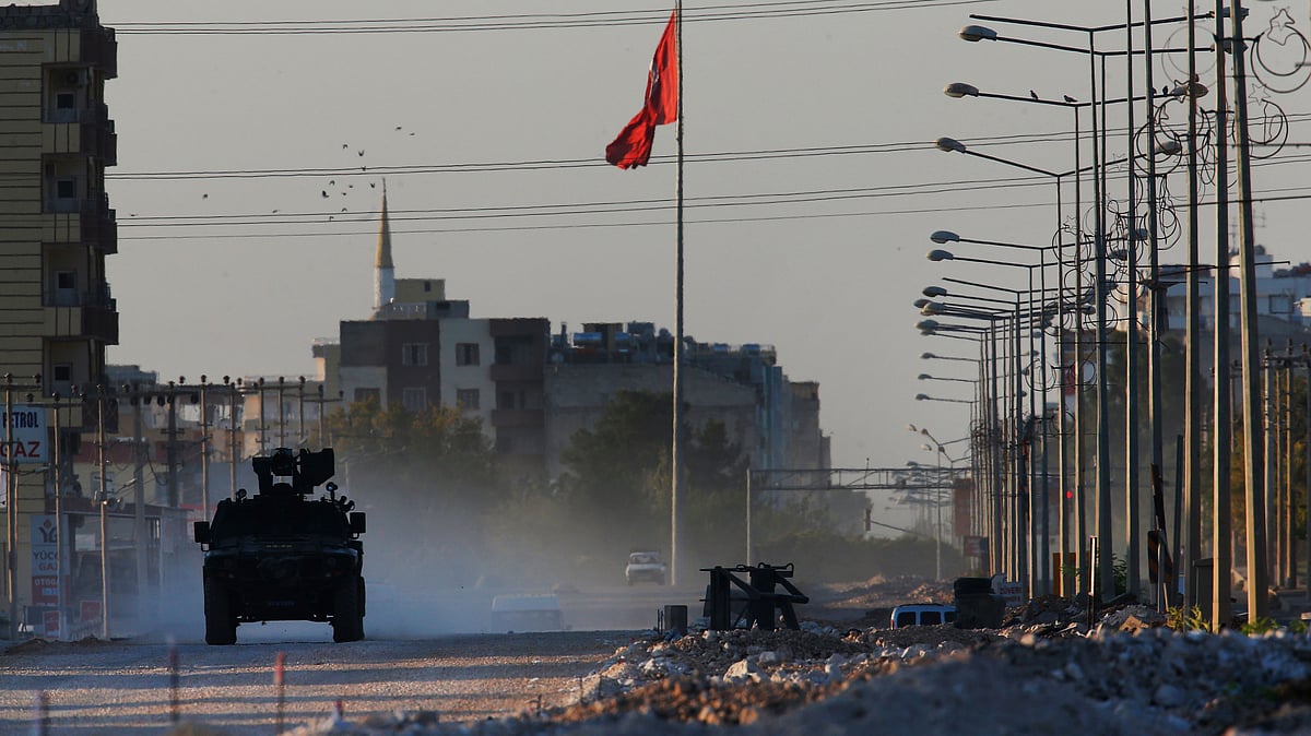 A Turkish police armoured vehicle patrols the town of Akcakale, Sanliurfa province, southeastern Turkey, at the border with Syria, Saturday, 12 October 2019.