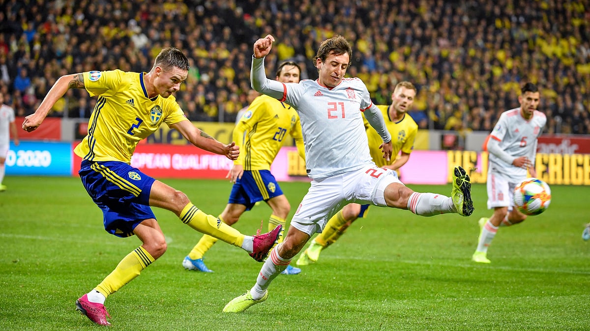 Sweden’s Mikael Lustig (L) and Spaibn’s Mikel Oyarzabal in action during the Euro 2020 Group F qualification soccer match between Sweden and Spain at Friends Arena in Solna, Stockholm, Sweden, on Oct. 15, 2019. 