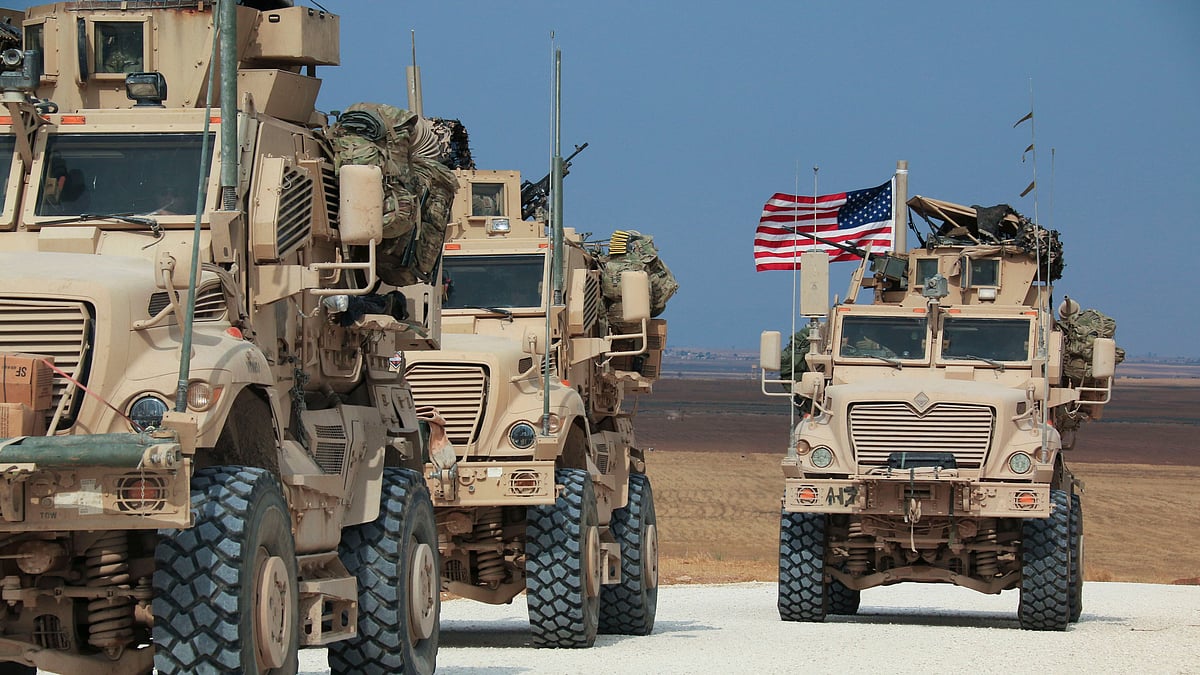 Kurdish-led fighters and Turkish-backed forces clashed sporadically Sunday in northeastern Syria amid efforts to work out a Kurdish evacuation from a besieged border town, the first pull-back under the terms of a US-brokered cease-fire
