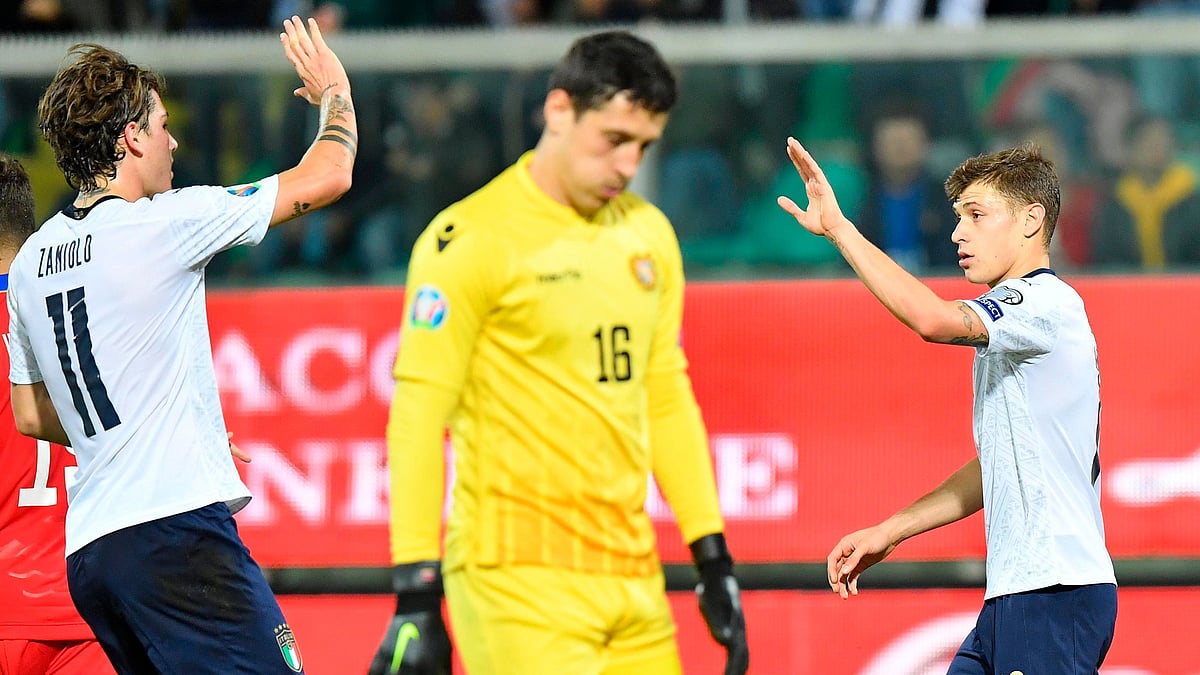 Italy’s Nicolo’ Barella, right, celebrates with teammate Nicolo’ Zaniolo after he scored his side’s third goal during a group J qualifying game between Italy and Armenia at the Renzo Barbera stadium, in Palermo, Italy.