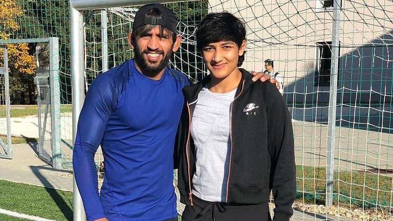 File photo of Bajrang Punia (L) and Sangeeta Phogat.