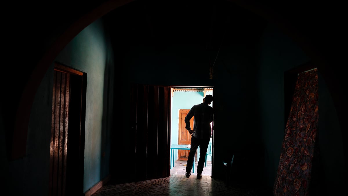 In this 23 August 2019 photo, a Honduran father stands at his home in Comayagua, 
