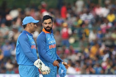 Dambulla: Indian skipper Virat Kohli and MS Dhoni during the first ODI International cricket match between India and Sri Lanka at Rangiri Dambulla International Stadium in Dambulla, Sri Lanka on Aug 20, 2017. (Photo: Surjeet Yadav/IANS)