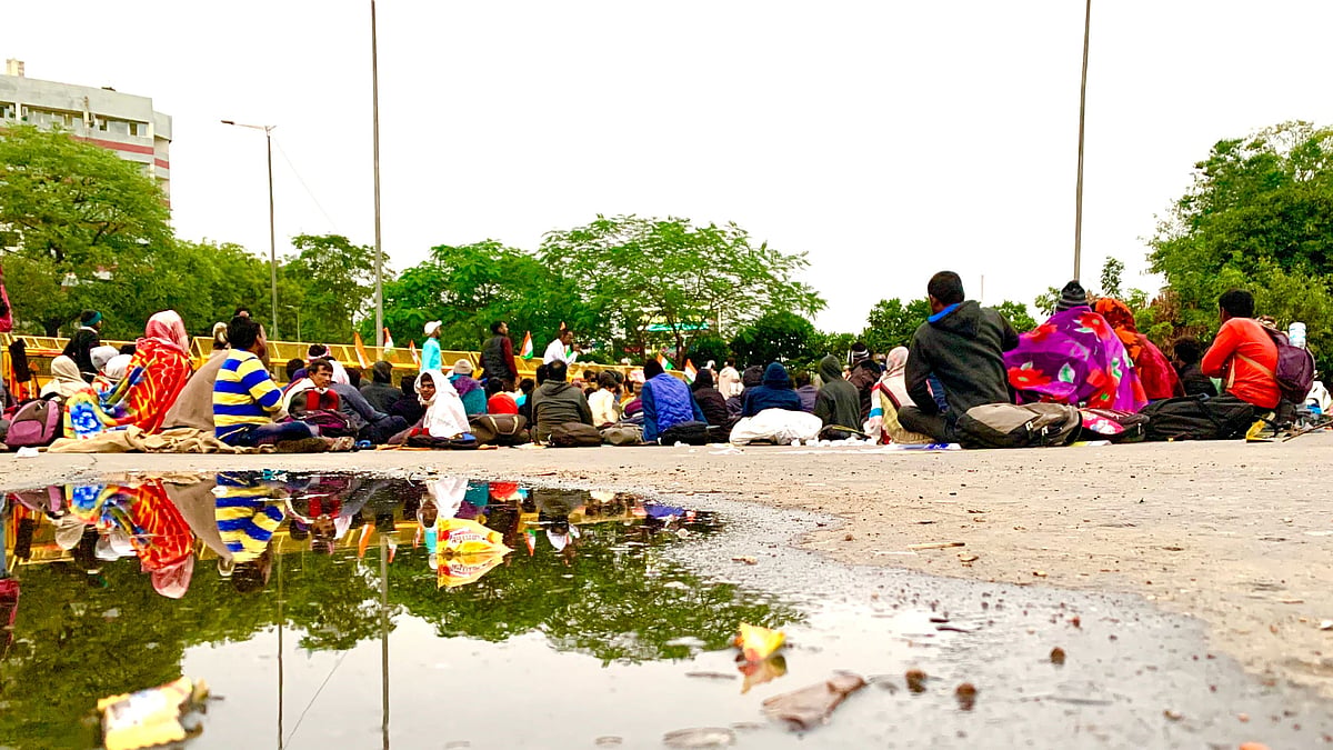 Protesters at Mandi House after the rain.