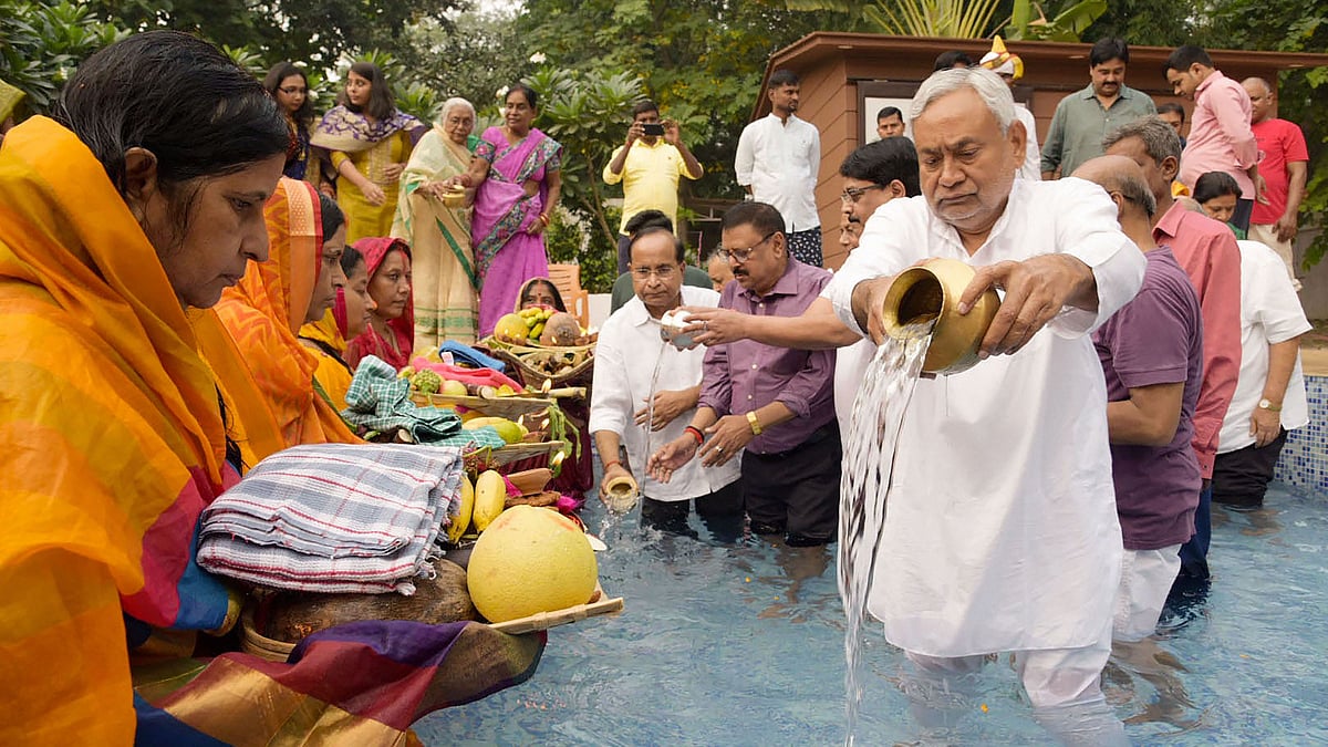 Bihar Chief Minister Nitish Kumar performs a ritual during Chhath Puja at his residence, in Patna.