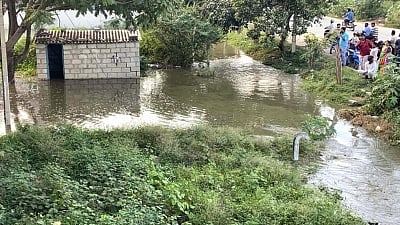 Bengaluru: Hulimavu lake breached and the water has flooded into many residents of surrounding areas of Hulimavu lake on Bannerghatta Road, in Bengaluru on Nov 25, 2019. (Photo: IANS)