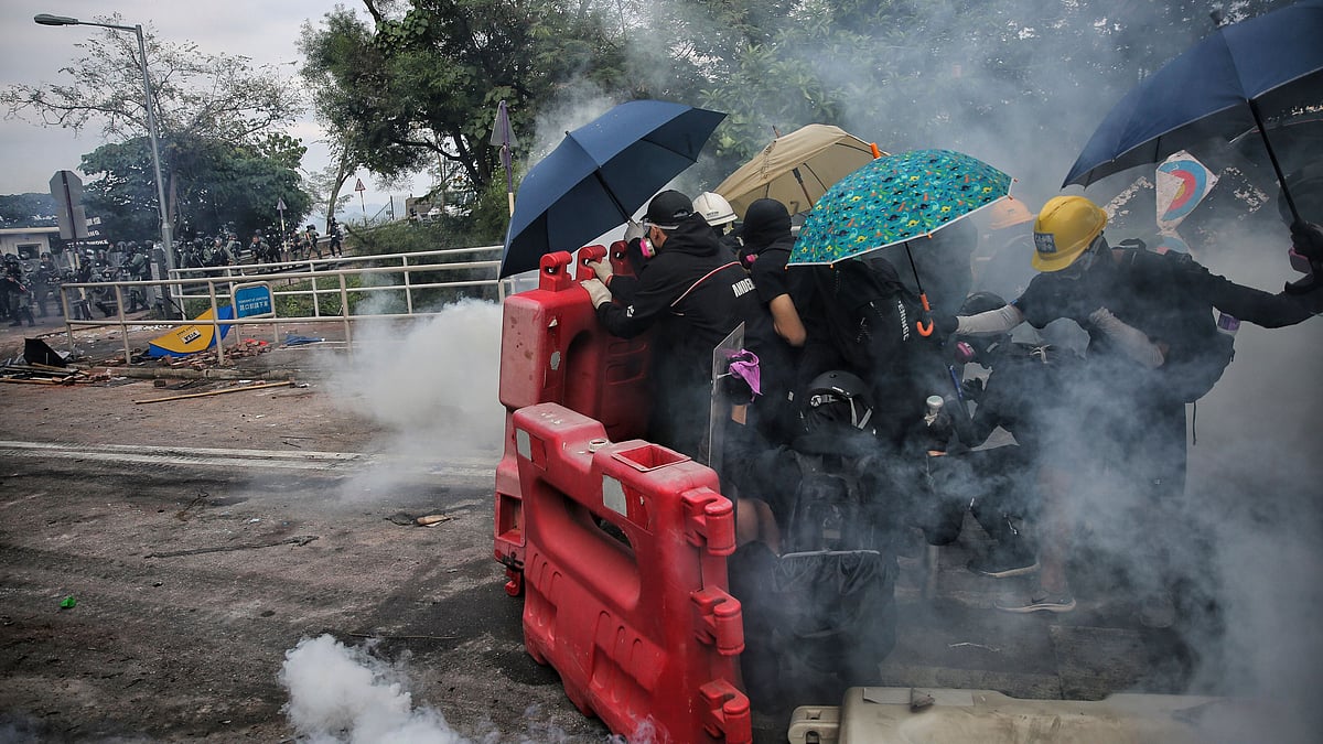 Police fired tear gas at protesters who littered streets with bricks and disrupted morning commutes. 