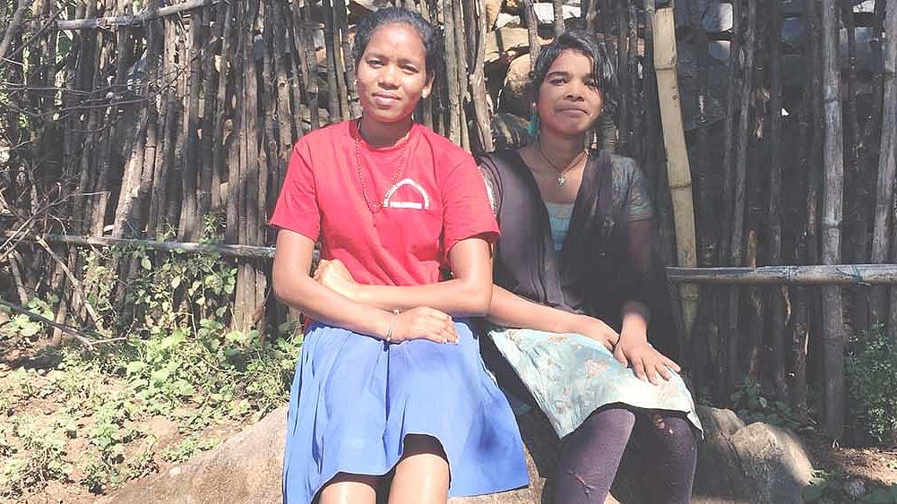 Momita Batra (left) and Karma Mandali, both aged 14, in Podieguda village in Odisha’s Malkangiri district, during Christmas break. Nine years ago, they enrolled in a residential school–the state government’s answer to low female literacy among the state’s tribal girls. These schools, we found, are poorly run and ripe for abuse.