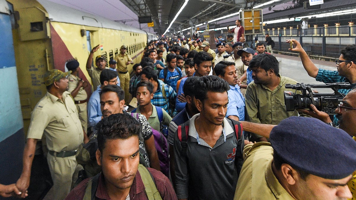 Workers from Jammu and Kashmir arrive at the station in Kolkata.