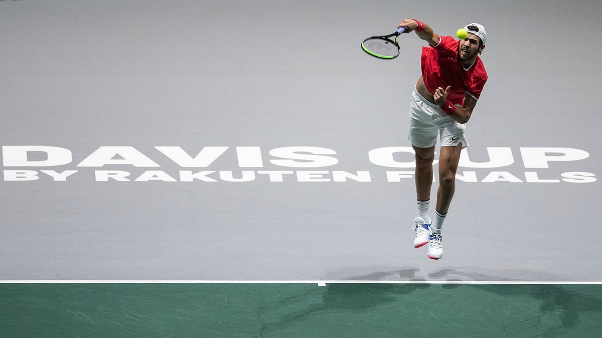 Russia’s Karen Khachanov serves to Croatia’s Borna Coric during their Davis Cup tennis match in Madrid, Spain, Monday.
