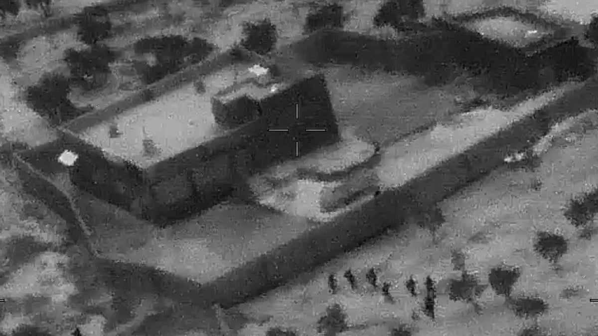 US Special Forces, figures at lower right, moving toward compound of Islamic State leader Abu Bakr al-Baghdadi.