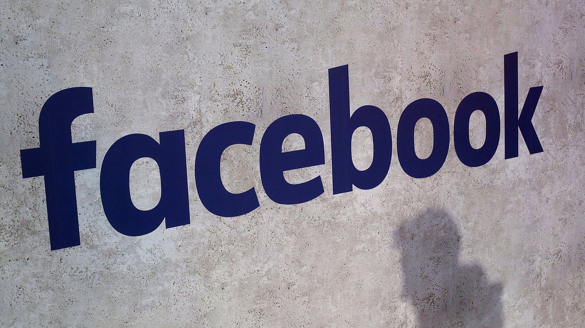 Facebook logo displayed at a business gathering in Paris