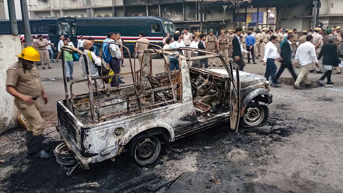 A police vehicle after it was burnt during clashes between lawyers and police personnel at Tis Hazari Court complex on Saturday, 2 November.
