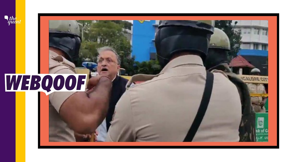 Social media users falsely claimed that a policeman tried to threaten Ramachandra Guha with a fist.
