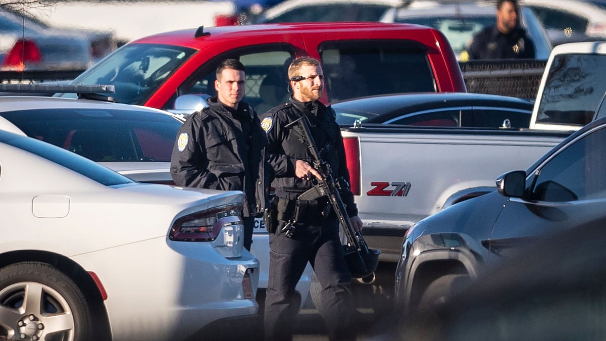A police officer with the Winston-Salem Police Department walks across the parking lot of the Joycelyn V. Johnson Municipal Services Center after reports of gunshots in North Carolina.&nbsp;