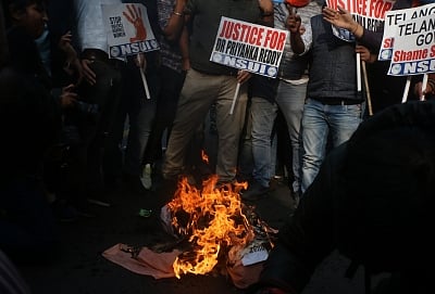 New Delhi: NSUI activists stage a demonstration against Telangana Government over the gruesome gang rape and murder of a woman veterinarian in Hyderabad; in New Delhi on Nov 30, 2019. (Photo: IANS)