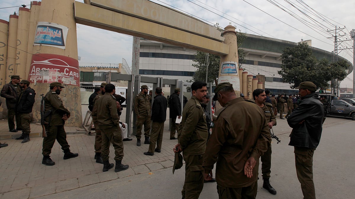 Police officers take positions outside the Pindi Cricket stadium to ensure security ahead of first Test match between Pakistan and Sri Lankan in Rawalpindi.