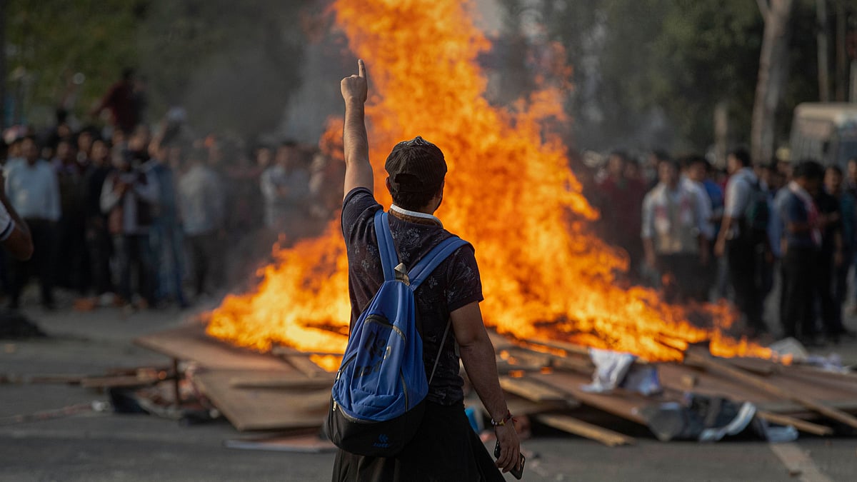 College students raise slogans in protest against Citizenship Amendment Bill (CAB) during a strike in Guwahati.