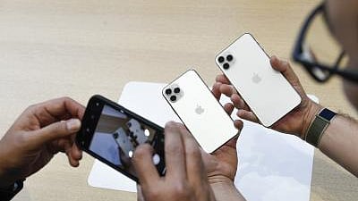 People try out new iPhones during a product launch event at Apple.