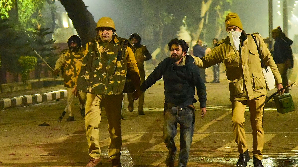 Police takes away a student in Uttar Pradesh’s Aligarh Muslim University.