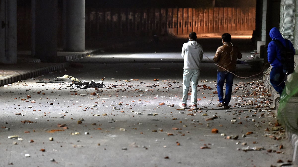 Pedestrians near Jamia Millia Islamia following a protest against Citizenship Amendment Act on Sunday, 15 December.