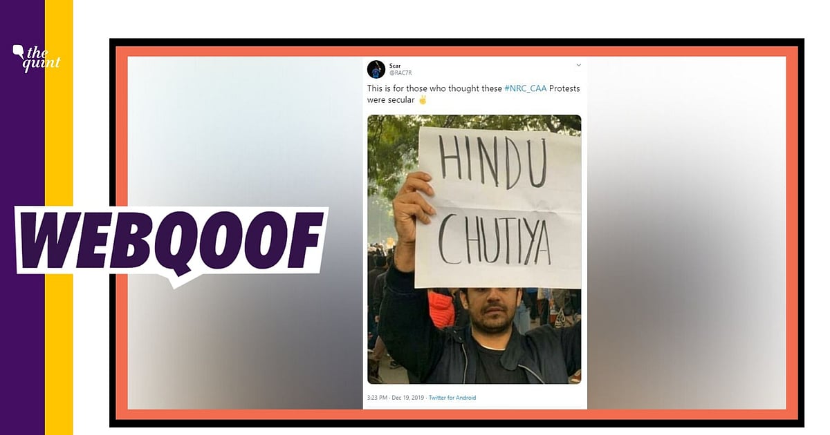 Image accompanying A protester held a poster abusing the Hindu community