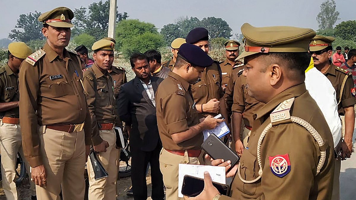  Police personnel investigate at the site where a rape victim was allegedly set ablaze by five men at Sindupur village in Unnao district.