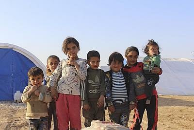 HASAKAH, Nov. 23, 2019 (Xinhua) -- Syrian children are seen in a refugee camp in the countryside of Hasakah City, Syria, Nov. 21, 2019. In the Twaineh area 10 km west of the northeastern city of Hasakah, the Kurdish militia set up a new refugee camp called Washokani for the increasing number of civilians fleeing the Turkish-led campaign that has been ongoing against the Kurdish militia in northeastern Syria since Oct. 9. (Str/Xinhua/IANS)