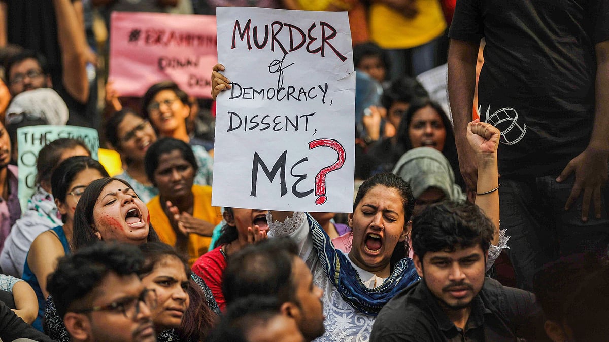 Students hold placards and shout slogans during a protest over the Citizenship Amendment Act in Mumbai onMonday