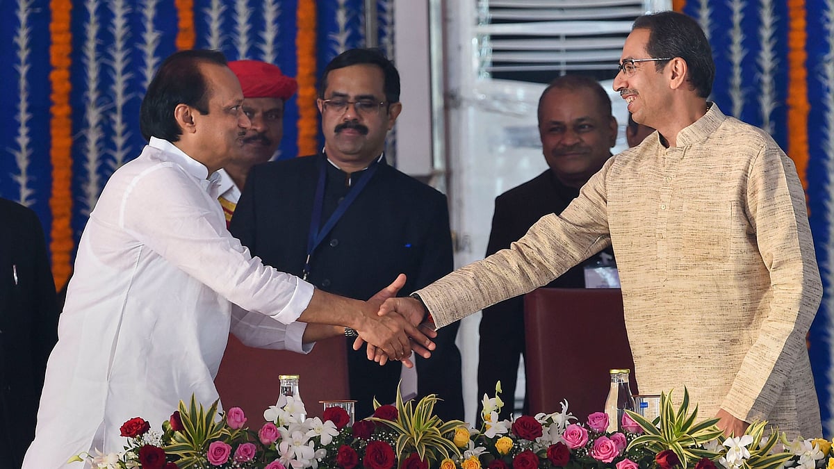 NCP leader Ajit Pawar shakes hands with Maharashtra Chief Minister Uddhav Thackeray.