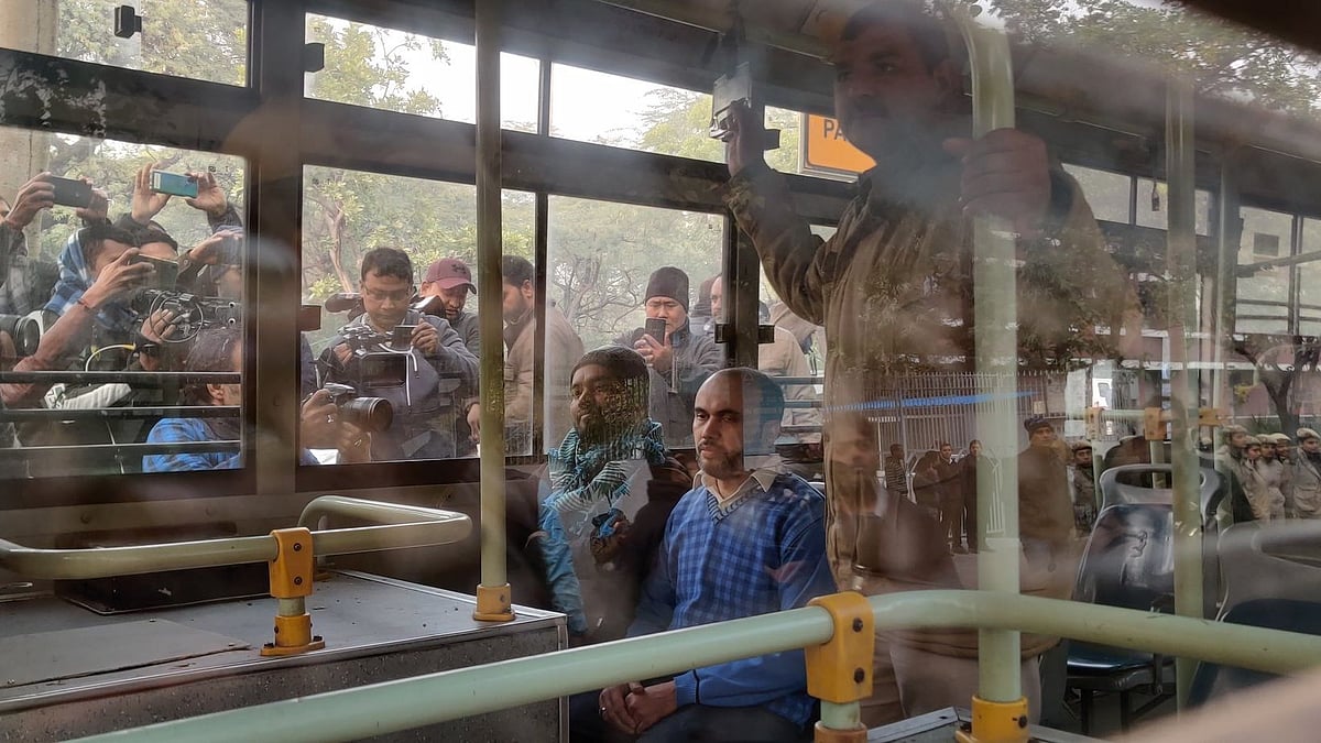 Protesters who were detained taken in buses by police.