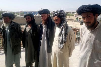 SARPOL, July 15, 2013 (Xinhua/IANS) -- Captured Taliban fighters stand handcuffed during a presentation for media held by Afghan police in Sarpol province, northern Afghanistan, on July 15, 2013. Afghan policemen captured five Taliban fighters during an operation in Sarpol province on Monday, police officials said. (Xinhua/Arui) (syq)