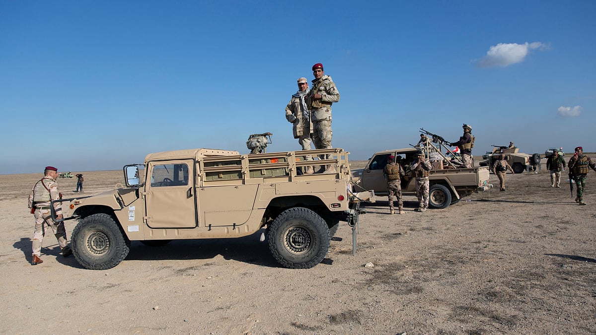 Iraqi army units are deployed during military operations of the Iraqi Army’s Seventh Brigade in Anbar, Iraq, on 29 December. 