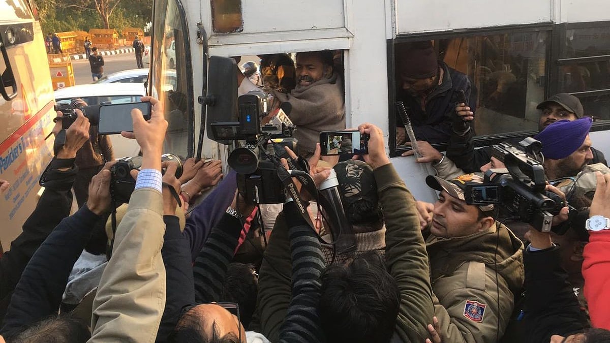 “We were just standing with the national flag and singing the national anthem,” Yogendra Yadav tweeted. 