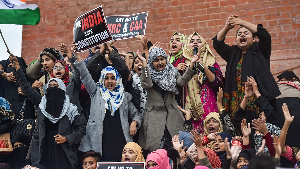Muslim women with children stage a protest against CAA and NRC, near Ghataghar in old Lucknow, Saturday, 18 January 2020.