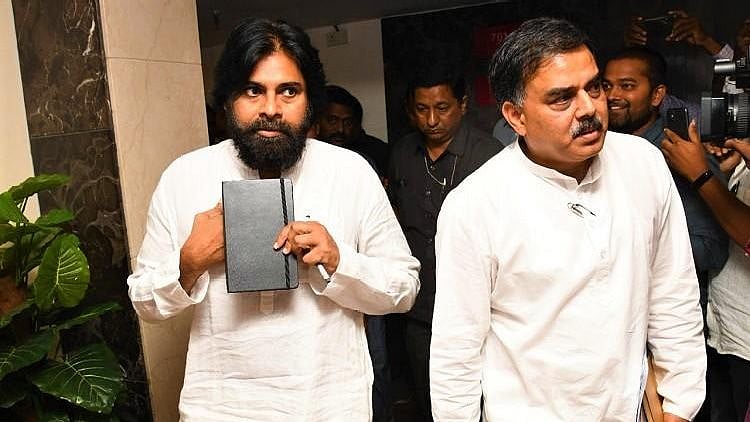 Pawan Kalyan (left) steps out of his meeting with BJP officials in Vijayawada.