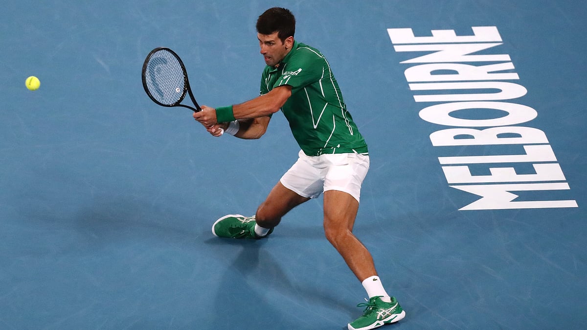 Novak Djokovic powered past Milos Raonic to set a blockbuster Australian Open semi-final against Roger Federer on Tuesday after the Swiss ace saved an incredible seven match points in one of his greatest escapes.
