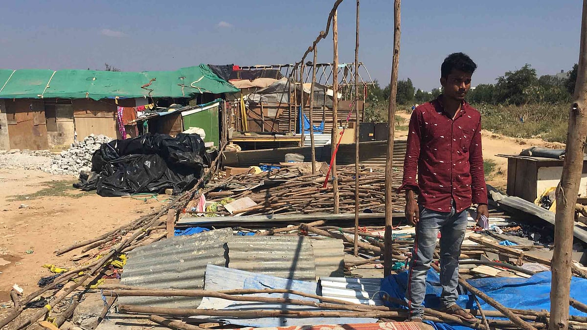 A man gazes at the ruins of his neighbourhood on Monday, 20 January, in Bengaluru’s Bellandur area. Cops and civic officials undertook took a demolition drive two days ago to evict ‘illegal Bangladeshi nationals’.
