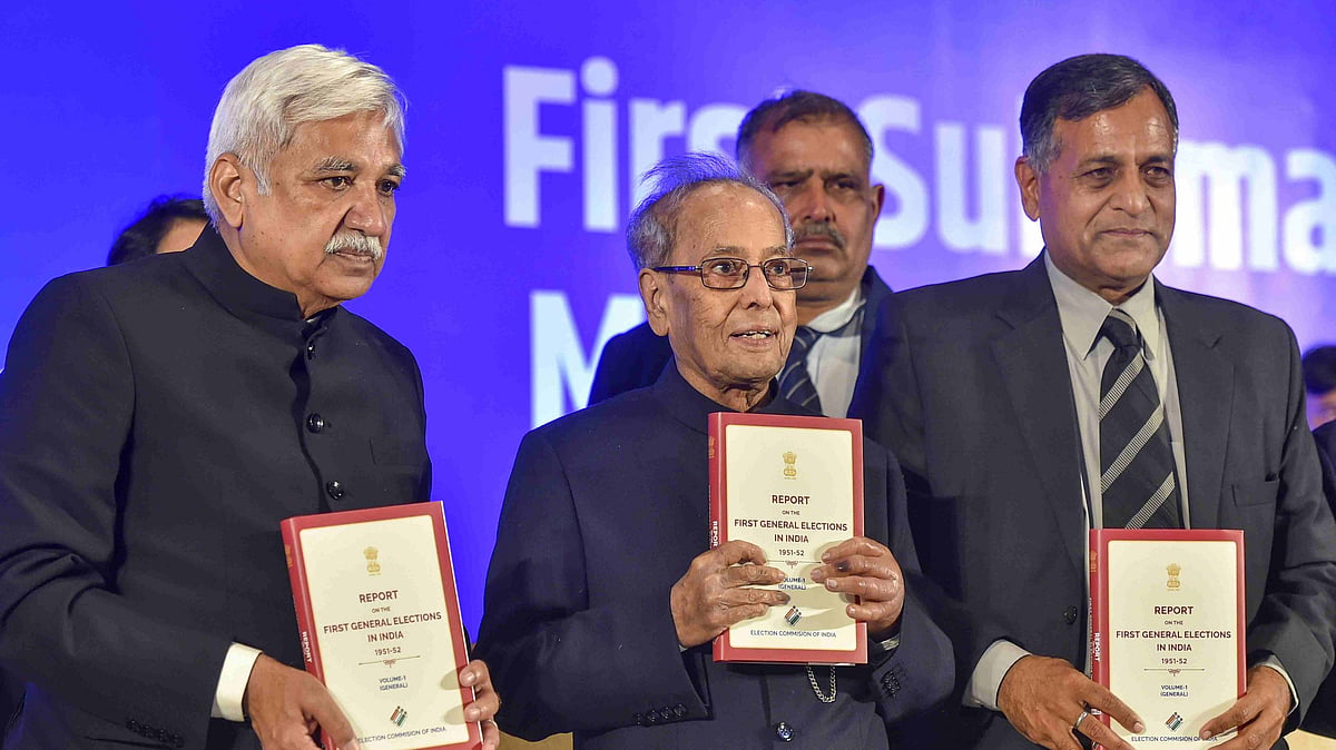 Former President Pranab Mukherjee with Chief Election Commissioner Sunil Arora and Election Commissioner Ashok Lavasa release a book in New Delhi on 23 January. 