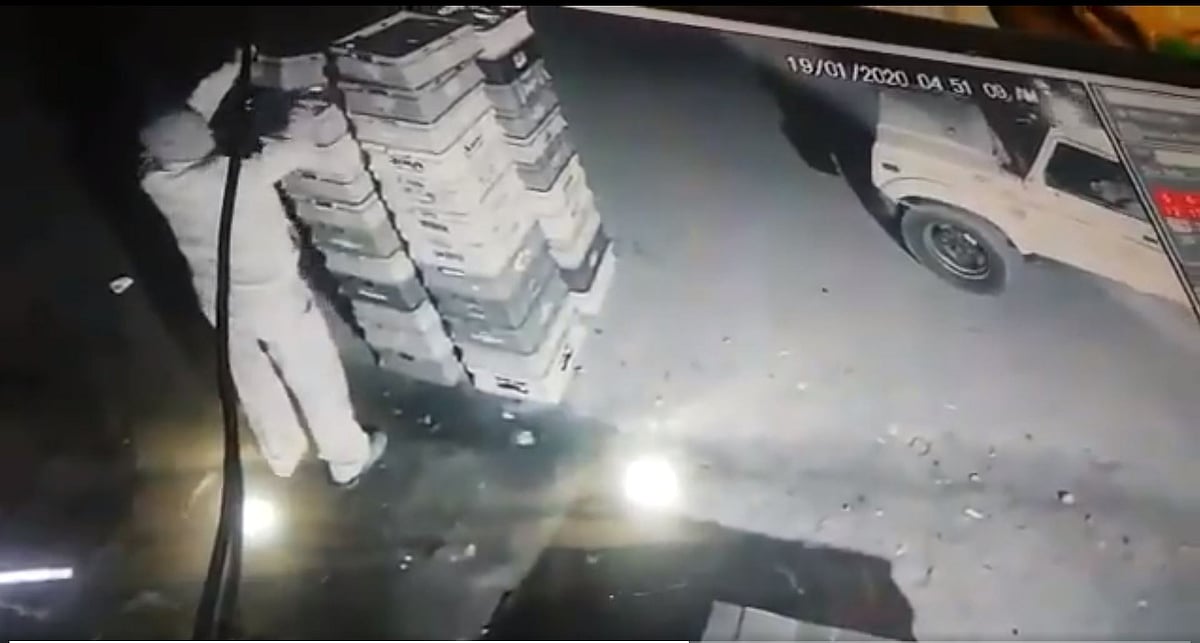 The person can be seen in the video taking two packets of milk and walking back to his patrol vehicle.