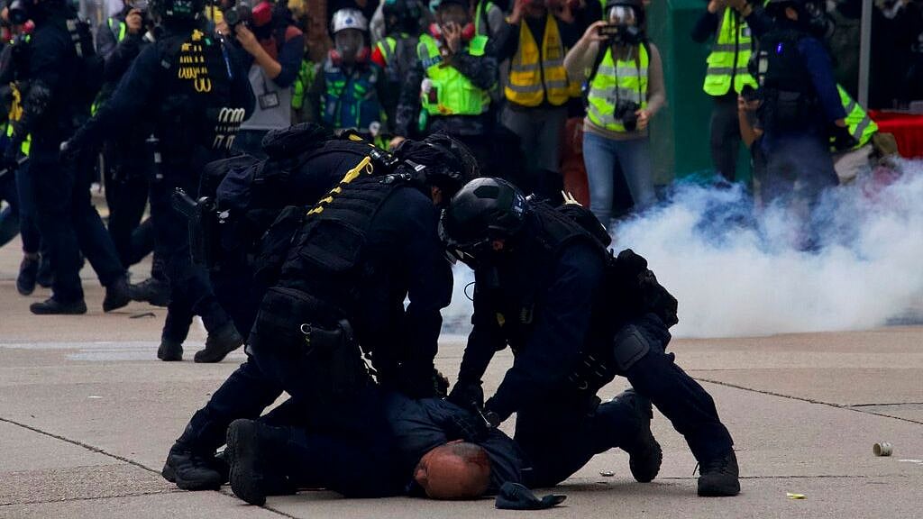 Police detain protesters calling for electoral reforms and a boycott of the Chinese Communist Party in Hong Kong, Sunday, 19 January 2020.