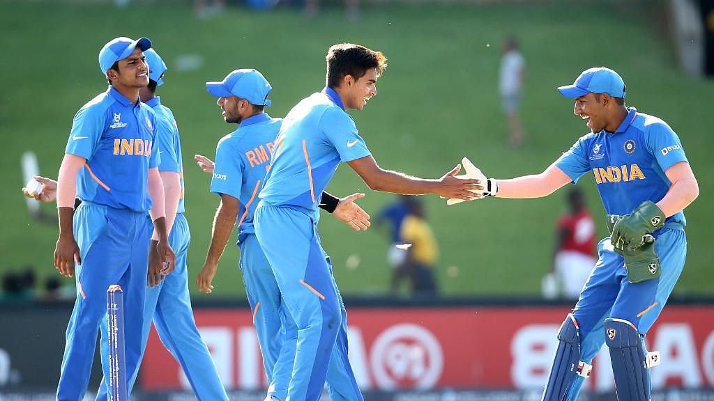 Batting first, defending champions India scored a competitive 297 for 4.