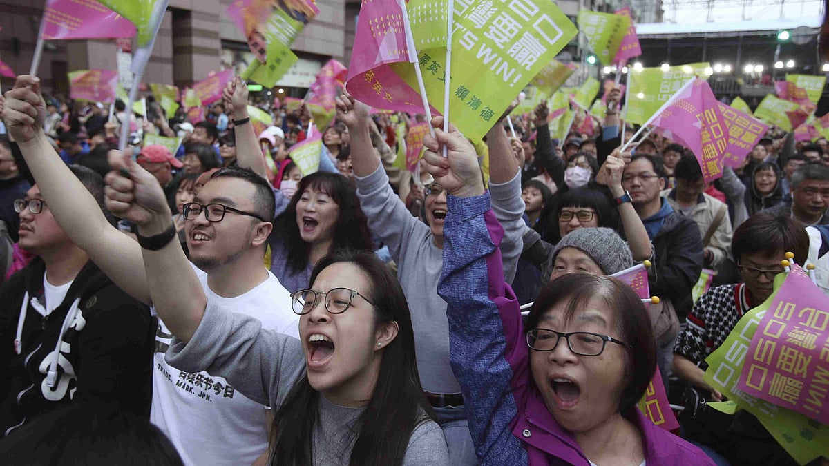 Supporters of Taiwan’s presidential election candidate, Taiwan president Tsai Ing-wen cheer for her victory as they gather to watch early election returns in Taipei, Taiwan. The banner reads “Taiwan Is An Independent Country”.