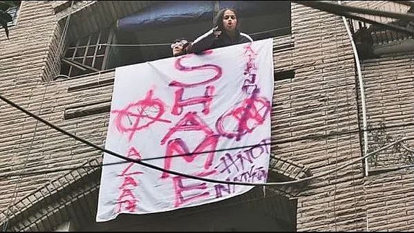 At least 150 people collected below their apartment and threatened to break down the door if they were not let in.