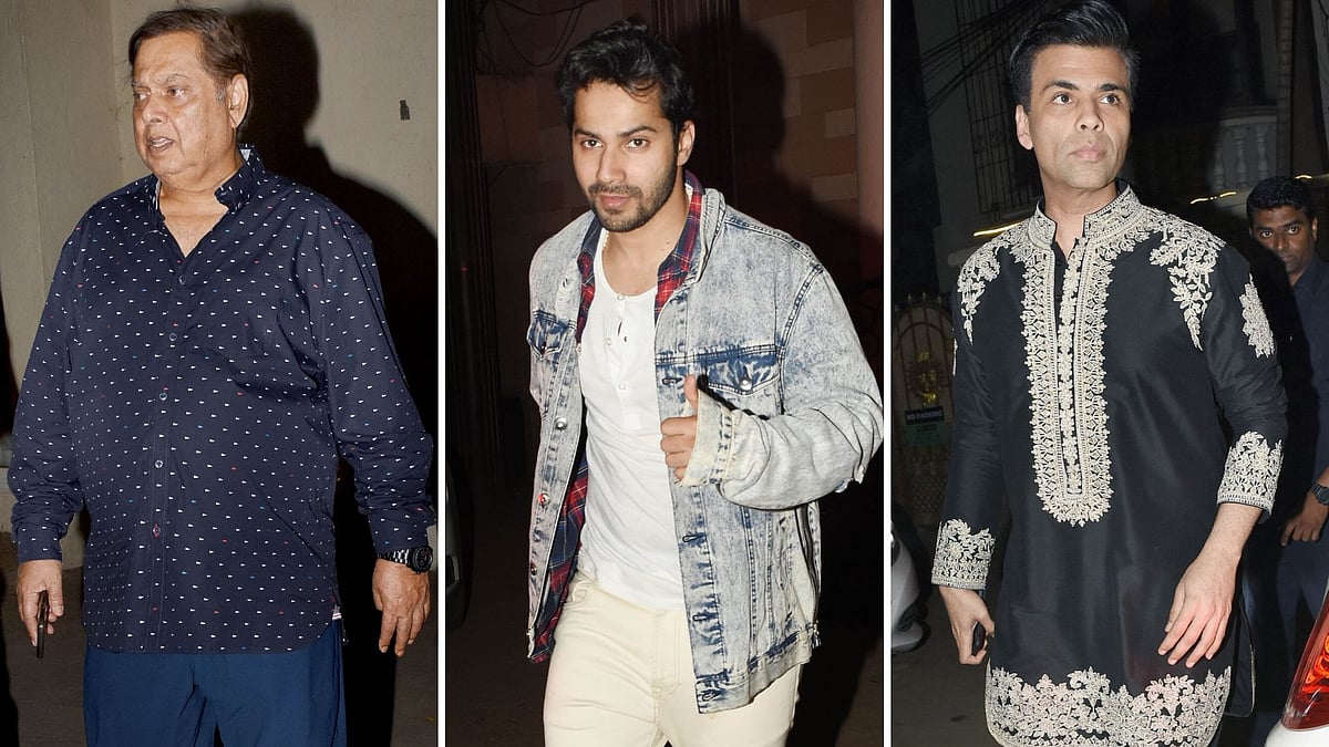 Varun Dhawan with father David and Karan Johar.