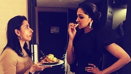 Deepika Padukone and sister Anisha Padukone eating fries.