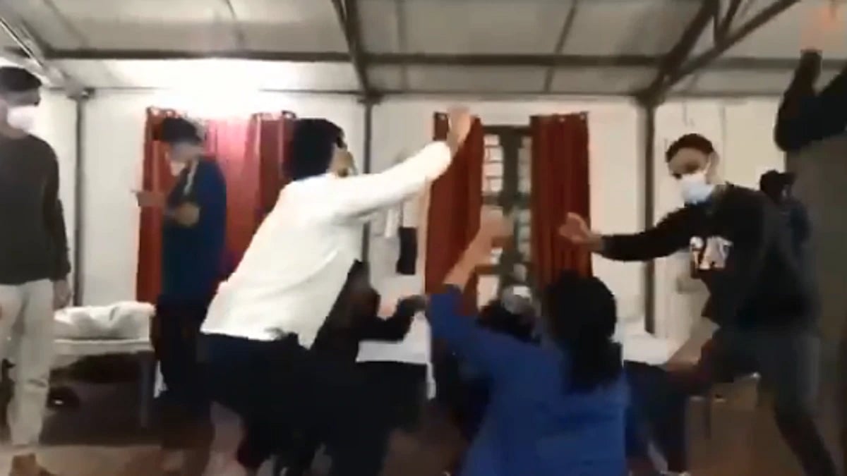 Students in the Manesar dance at the isolation facility.